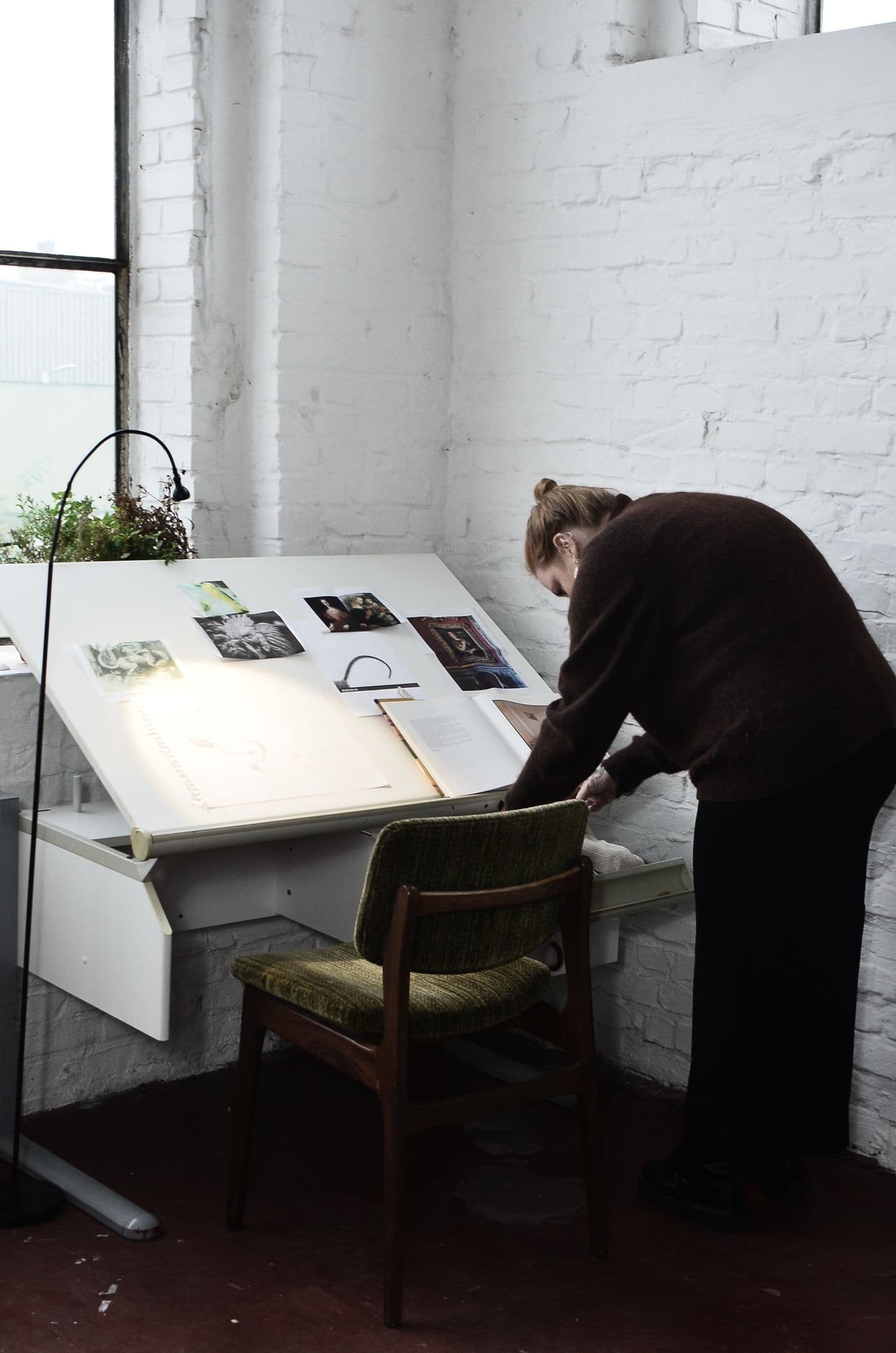 Woman preparing work in a workshop