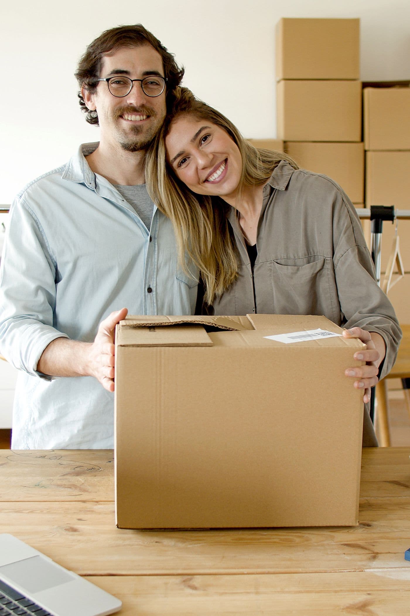 Two people holding a package