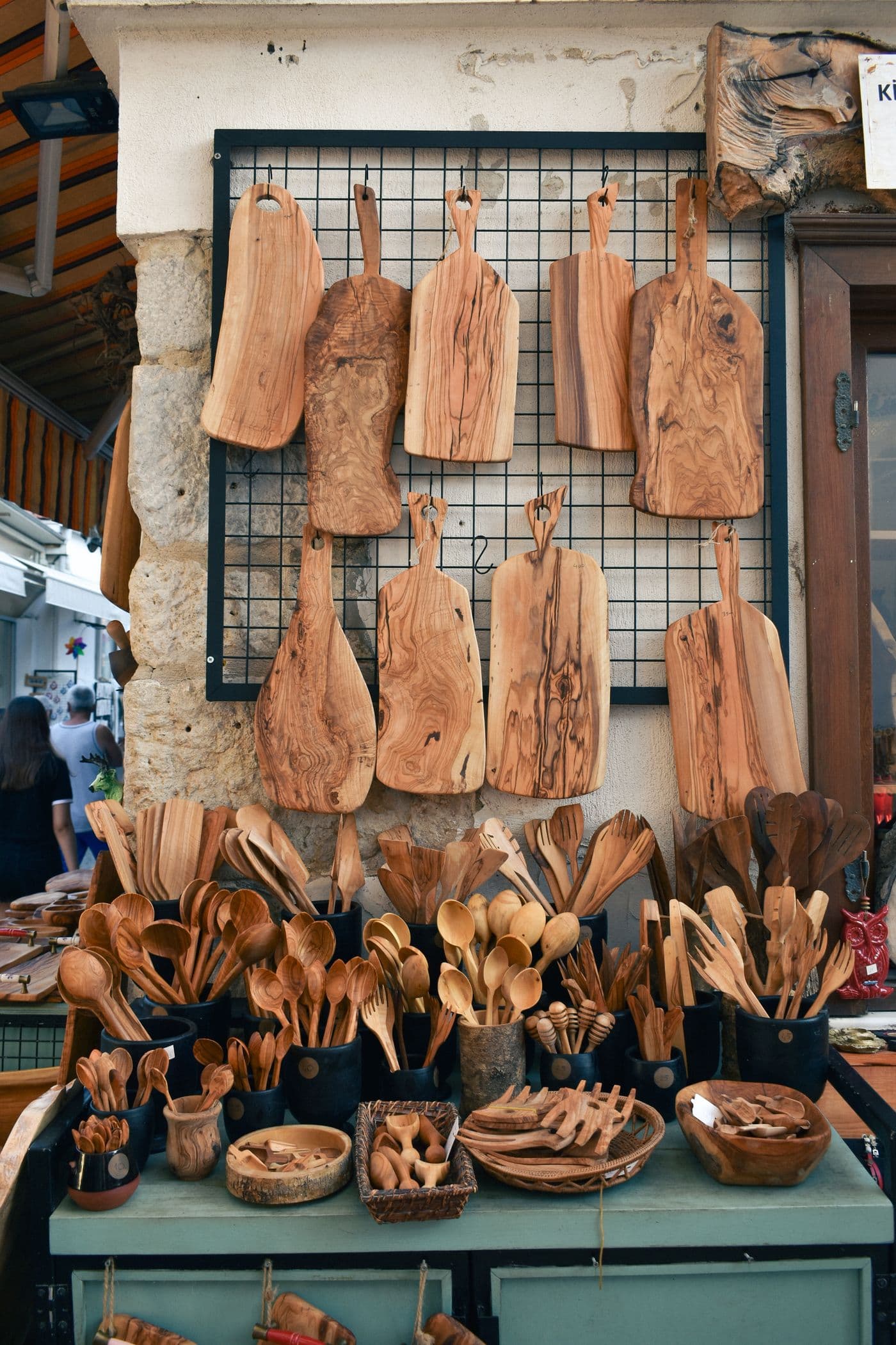 Wooden kitchenware displayed on a shop stand